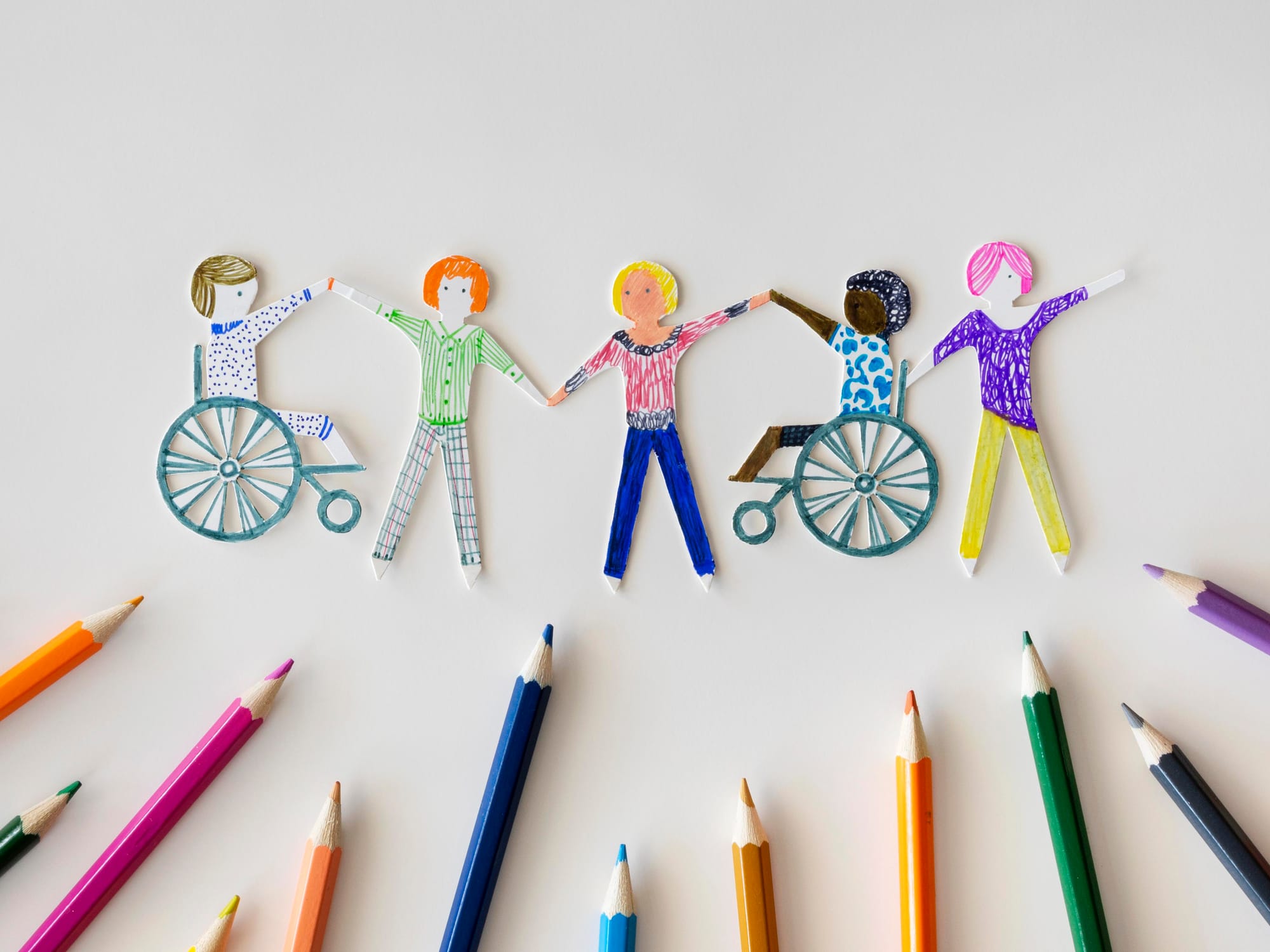 multi-ethnic-disabled-people-community-with-pencils.jpg